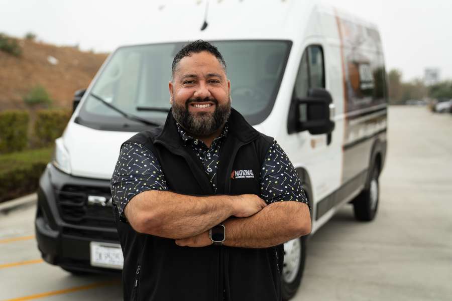 Ray Barela in front of an NFP van