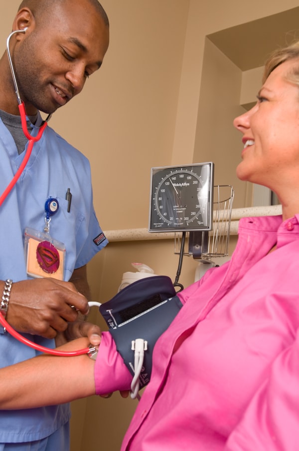 Physician with tablet reviewing patient data